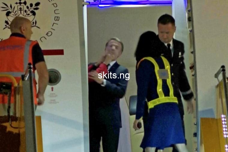 French president emmanuel macron addresses his wife shoving him in the face on aircraft